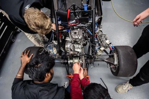 Students working on a vehicle